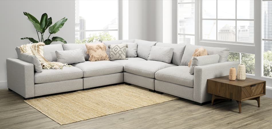 a corner lounge suite in a bright room