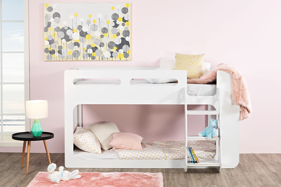 White bunk against pink wall